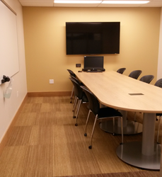 Picture of a larger study room with widescreen monitor.